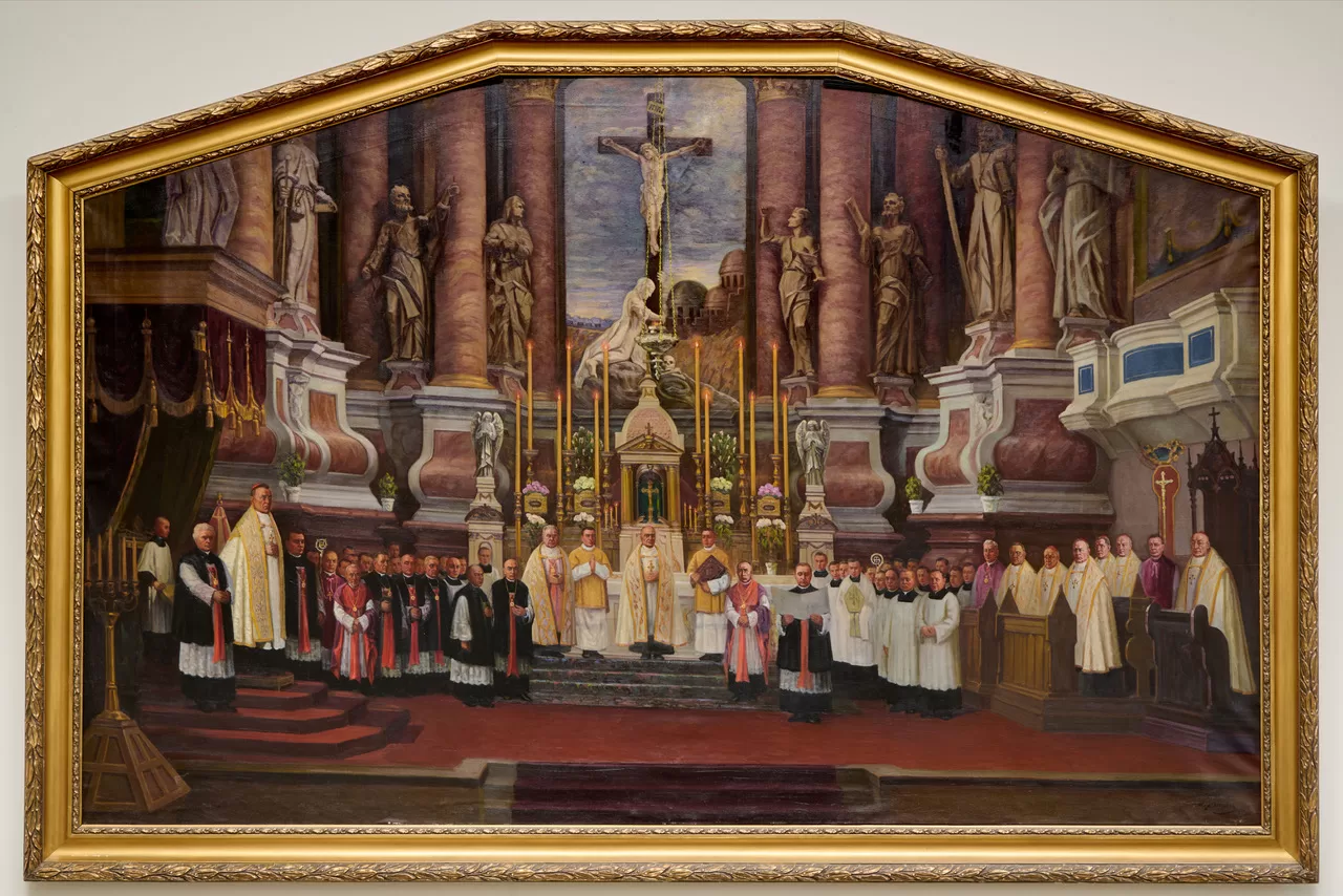 Jonas Janulis, „Lietuvos bažnytinės provincijos įkūrimo iškilmė Kauno arkikatedroje bazilikoje 1926 m. gegužės 13 d.“ Pirmoje eilėje iš kairės stovi: kan. Juozas Tumas-Vaižgantas, Kauno arkivyskupas Juozapas Jonas Skvireckas, Teologijos fakulteto dekanas kan. Blažiejus Čėsnys, prel. Aleksandras Grigaitis, prel. Aleksandras Dambrauskas-Jakštas, kurijos kancleris kan. Juozapas Byla, kan. Povilas Dogelis, kan. Adolfas Sabaliauskas, kan. Stanislovas Jokūbauskis, kan. Jonas Mačiulis-Maironis, neatpažintas diakonas, apaštališkasis administratorius arkivyskupas Jurgis Matulaitis MIC, neatpažintas diakonas, prel. Povilas Januševičius, seminarijos rektorius kan. Pranas Penkauskas, neatpažintas seminaristas, kun. Pranciškus Venckus, kun. Morkus Morkelis, kun. Stanislovas Ūsoris, prel. Kazimieras Šaulys, Telšių vyskupas Justinas Staugaitis, Vilkaviškio vyskupas Antanas Karosas, Panevėžio vyskupas Kazimieras Paltarokas, prel. Mečislovas Reinys, Kaišiadorių vyskupas Juozapas Kukta, neatpažintas kunigas, arkivyskupas Pranciškus Karevičius MIC